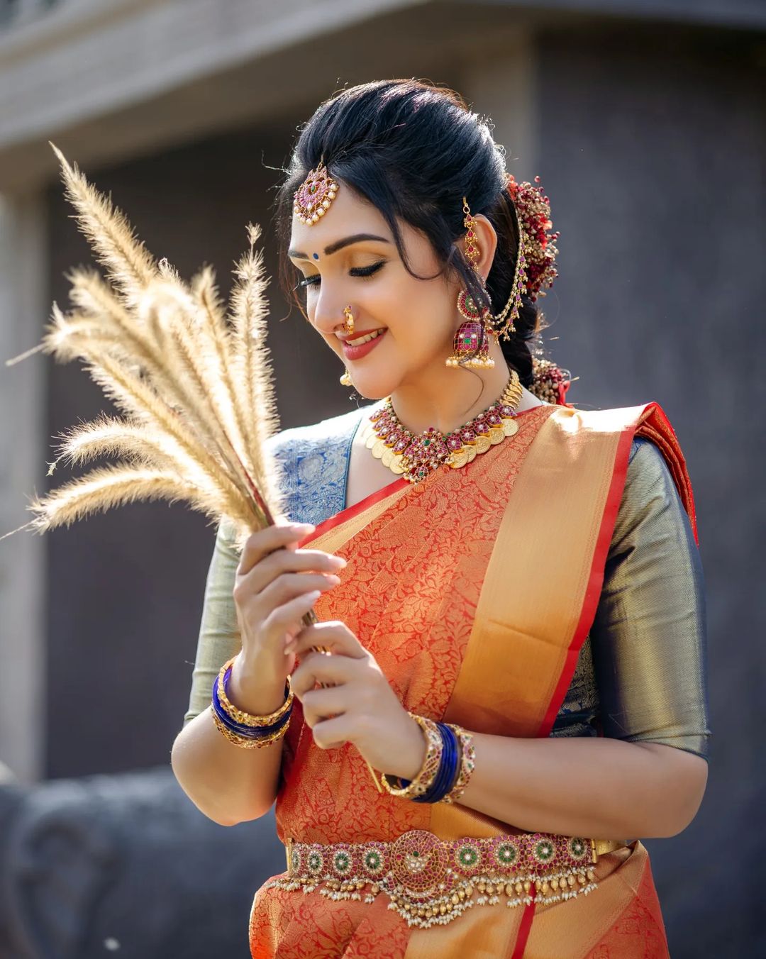 Telugu TV Actress Sridevi Vijaykumar Images in Orange Saree Blue Blouse 6
